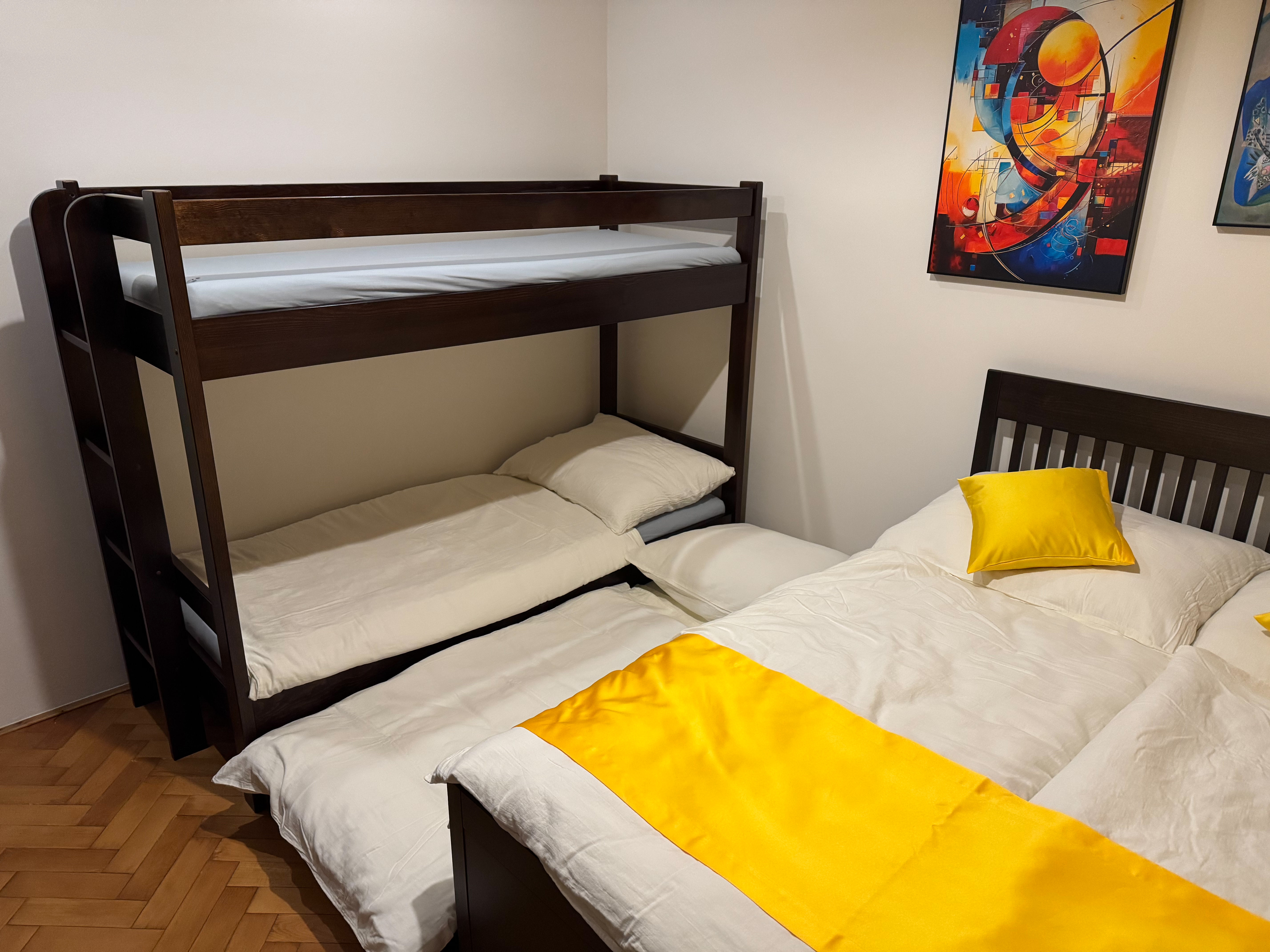 The extra sleeping area with its modern bedding