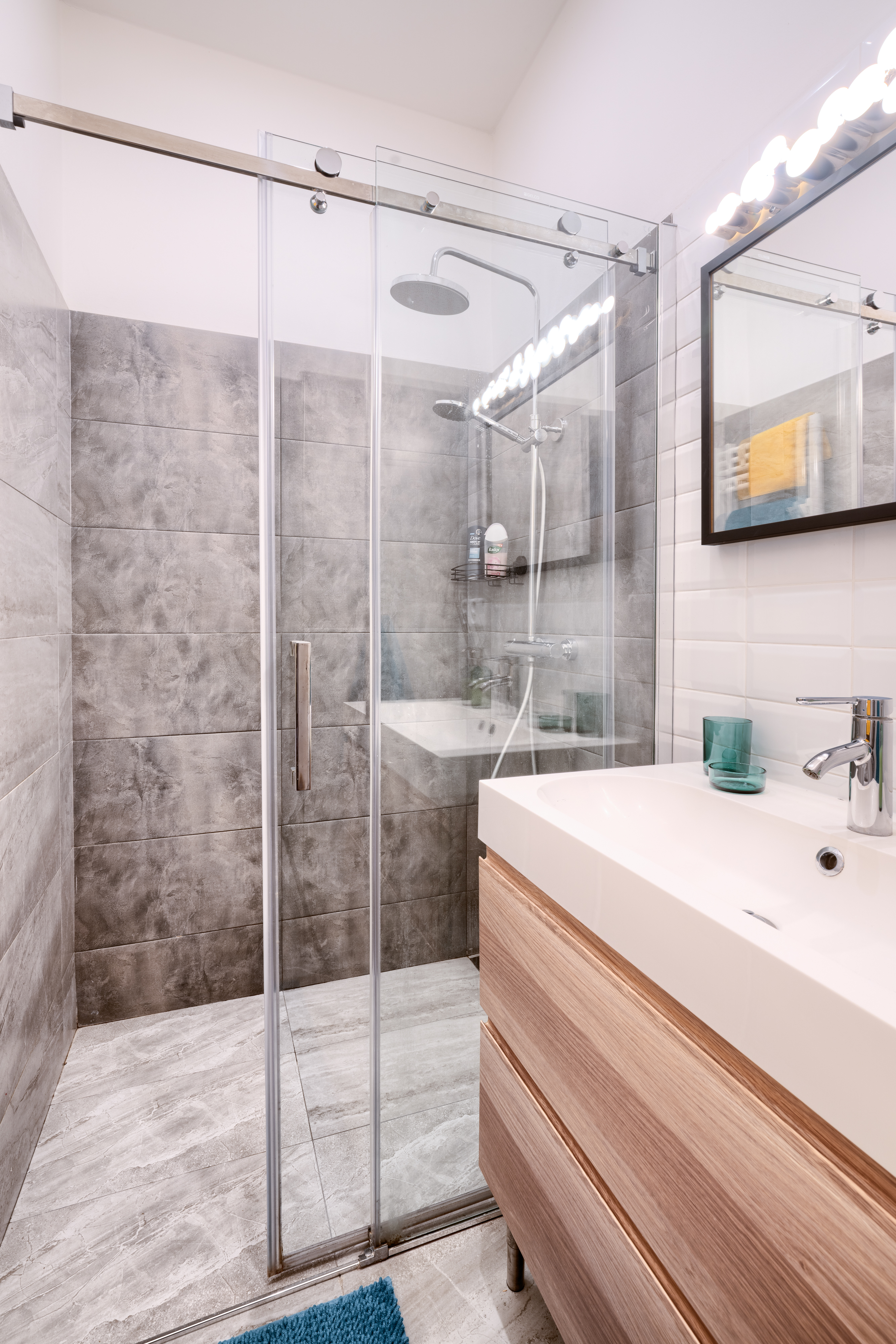 The bathroom's storage space and clean design