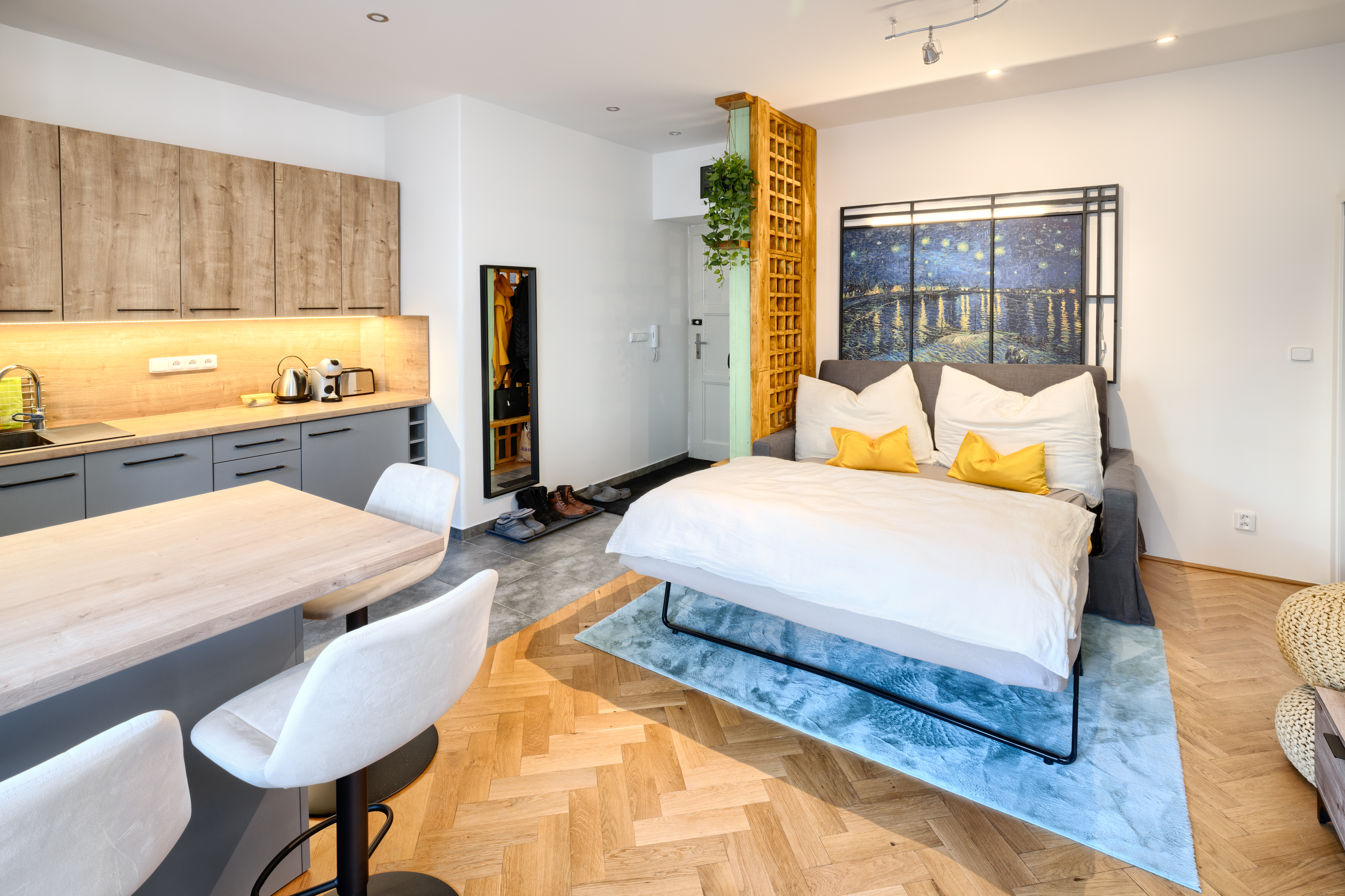 The living room's large windows offering beautiful views of the city